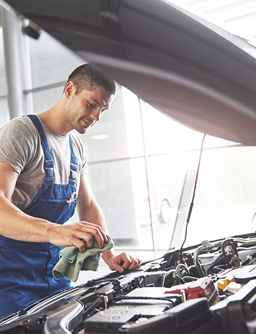 auto mechanic checking car